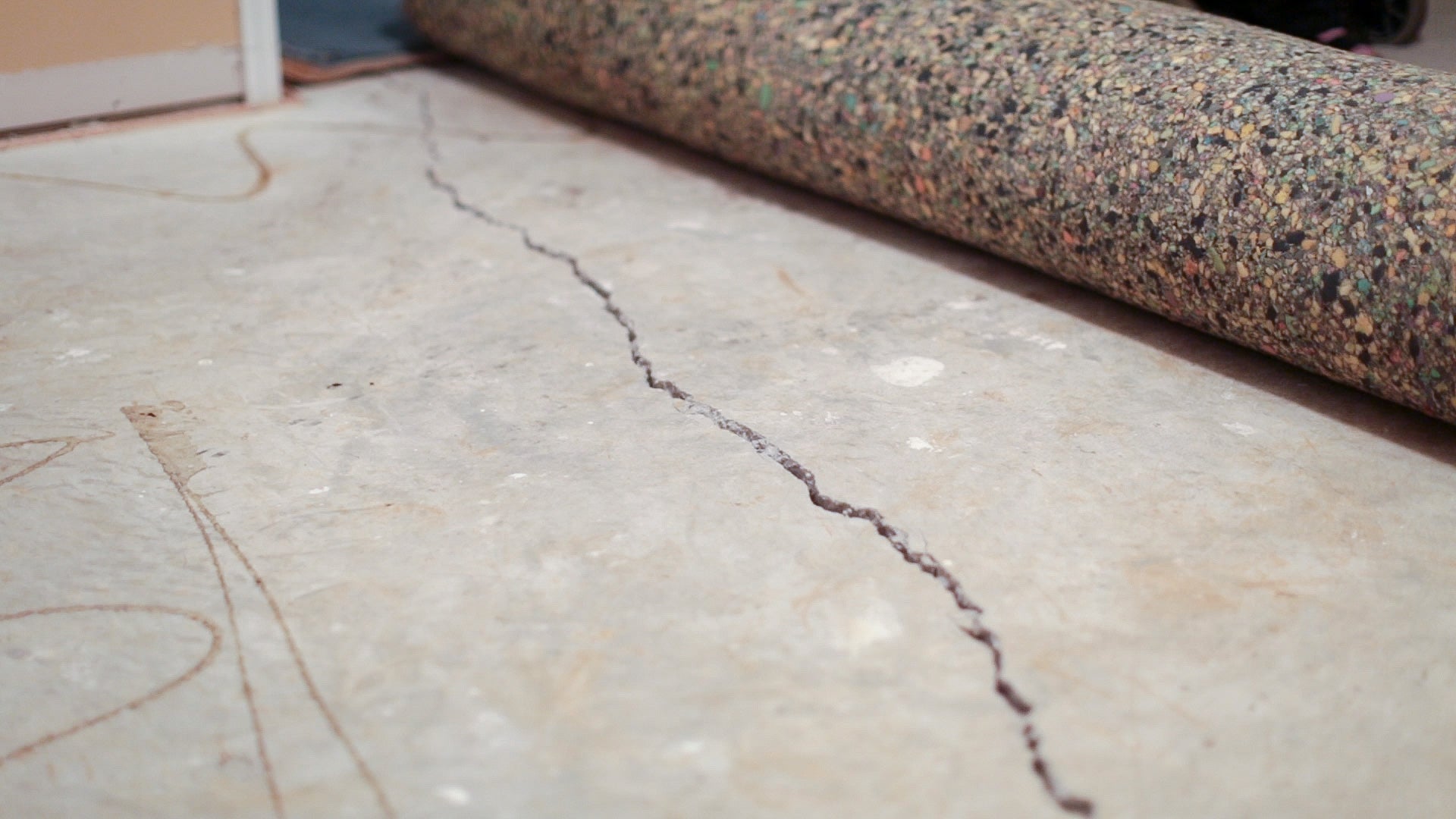 What Causes Basement Concrete Floors to Crack Over Time?
